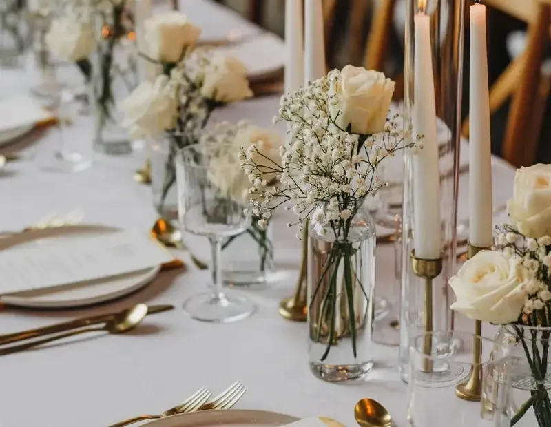 Budget Wedding Table Setting Ideas with Gold Cutlery and White Roses