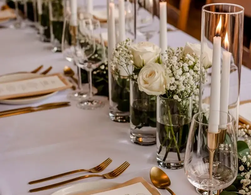 Elegant Wedding Table Setting with Gold Cutlery and Tall Candles | Romantic Reception Ideas